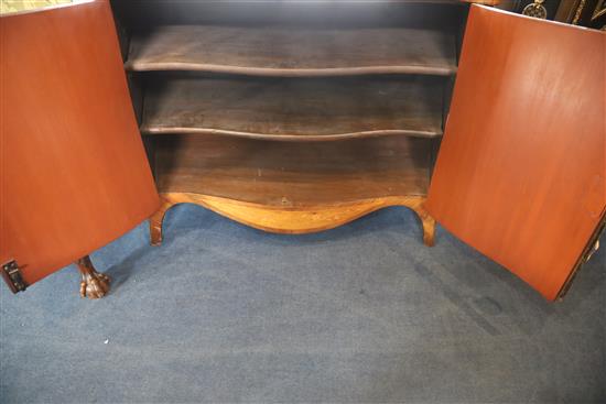 A late 19th century French marquetry inlaid serpentine commode, W.3ft 10in. D.1ft 8in. H.2ft 8.5in.